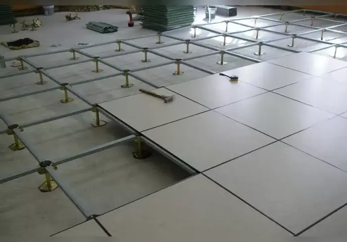 Raised floor systems are used to conceal the passage of electrical and mechanical services across the ground.